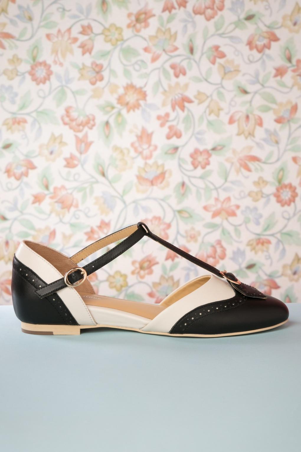 Parisienne Flache Schuhe mit T-Strap in Schwarz und Creme